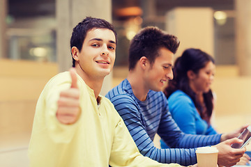 Image showing group of students with tablet pc and coffee cup