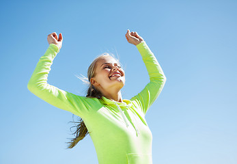 Image showing woman runner celebrating victory