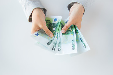 Image showing close up of woman hands counting euro money