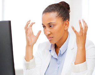 Image showing stressed african woman with computer