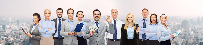 Image showing group of happy businesspeople with dollar money