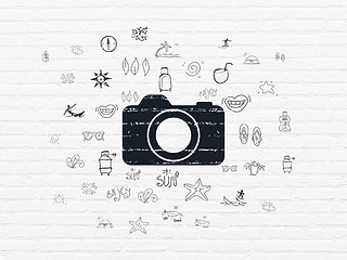 Image showing Vacation concept: Photo Camera on wall background