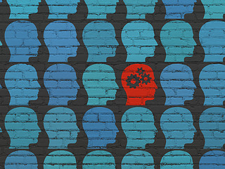 Image showing Learning concept: head with gears icon on wall background