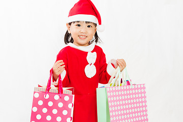 Image showing Asian Little Santa Claus with shopping bag