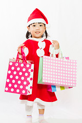 Image showing Asian Little Santa Claus with shopping bag