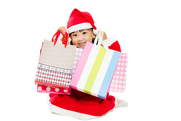 Image showing Asian Little Santa Claus with shopping bag