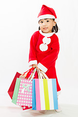 Image showing Asian Little Santa Claus with shopping bag