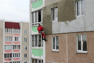 Image showing specialist carring out warming of building