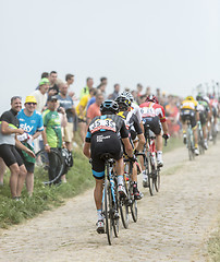 Image showing The Peloton on a Cobblestoned Road - Tour de France 2015