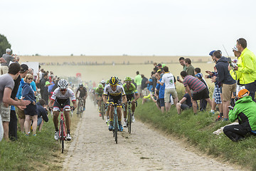 Image showing The Peloton on a Cobblestoned Road - Tour de France 2015