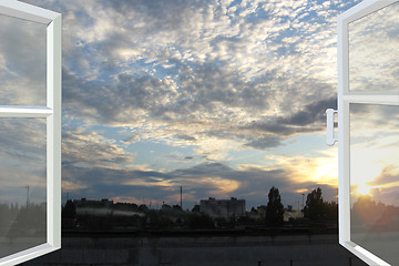 Image showing window opened to the sunset