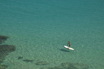 Image showing Stand-up paddle in a crystalline sea beach in Fernando de Noronha,Brazil