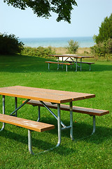 Image showing Picnic Tables on the Shore