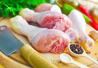 Image showing Raw chicken on wooden board, Chicken with spice