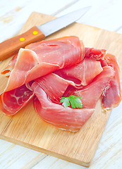 Image showing Proscuitto on a wooden board