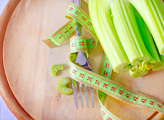 Image showing metr and fork on the wooden board