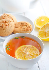 Image showing Fresh tea with lemon in the white cup