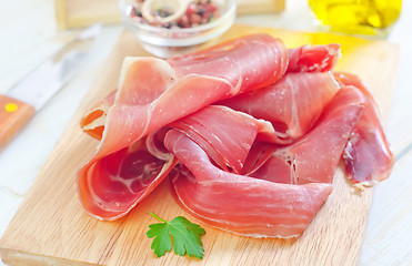 Image showing Proscuitto on a wooden board