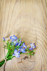 Image showing flowers on wooden background