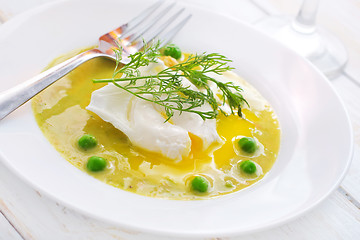 Image showing Fresh soup from green peas and egg-poached