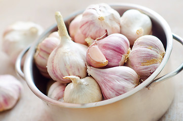 Image showing garlic in metal bowl on the table