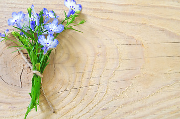 Image showing flowers on wooden background