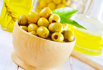 Image showing green olives and oil