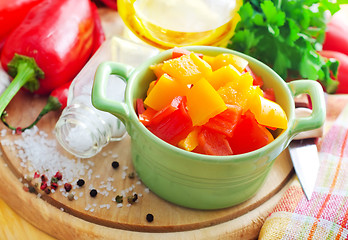 Image showing Color peppers on the wooden board, pepper and knife