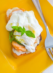 Image showing Close Up of Poached Delicious Egg with Whole Grain Bread