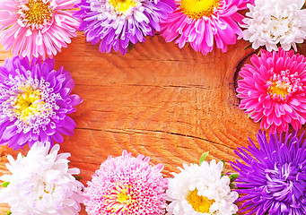 Image showing flowers on wooden background