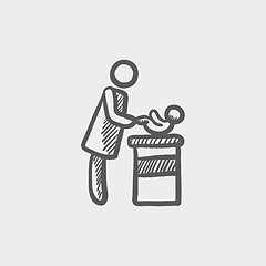 Image showing Woman changing the babys diaper sketch icon