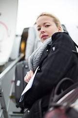 Image showing Woman boarding airplain.