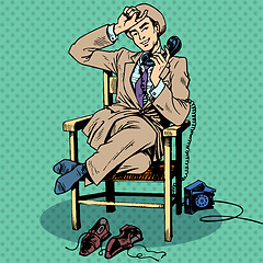 Image showing Tired man sits chair talking phone