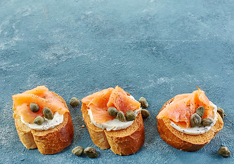 Image showing toasted bread with salmon fillet and cream cheese