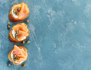 Image showing toasted bread with salmon fillet and cream cheese