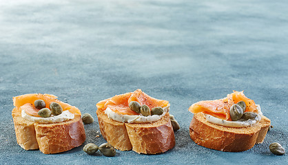 Image showing toasted bread with salmon fillet and cream cheese