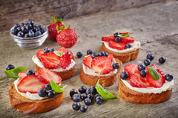 Image showing toasted bread with cream cheese and berries