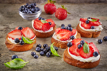 Image showing toasted bread with cream cheese and berries