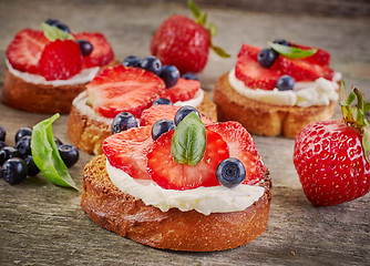 Image showing toasted bread with cream cheese and berries