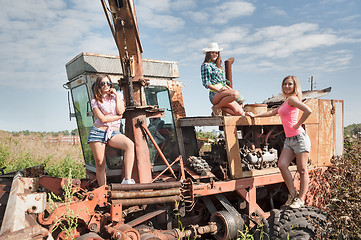 Image showing Beautiful women on old harvester