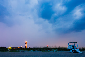 Image showing tybee island beach lighthouse with thunder and lightning