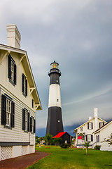 Image showing tybee island beach lighthouse with thunder and lightning