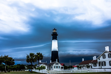 Image showing tybee island beach lighthouse with thunder and lightning