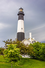 Image showing tybee island beach lighthouse with thunder and lightning