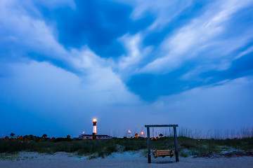 Image showing tybee island beach lighthouse with thunder and lightning