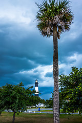 Image showing tybee island beach lighthouse with thunder and lightning