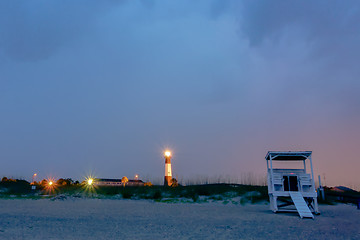 Image showing tybee island beach lighthouse with thunder and lightning