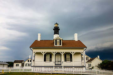 Image showing tybee island beach lighthouse with thunder and lightning