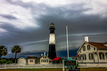 Image showing tybee island beach lighthouse with thunder and lightning