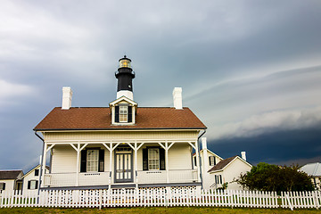 Image showing tybee island beach lighthouse with thunder and lightning